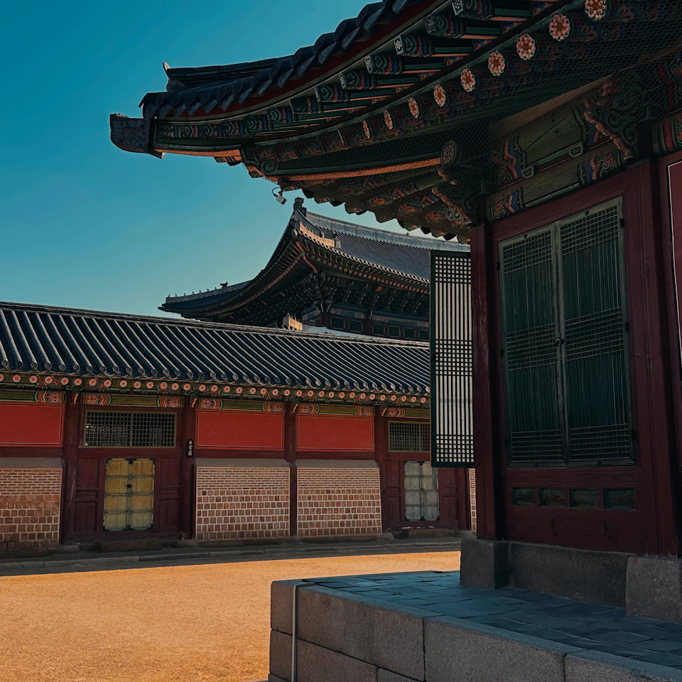 Gyeongbokgung Palace in Seoul under a clear blue sky on a bright sunny day