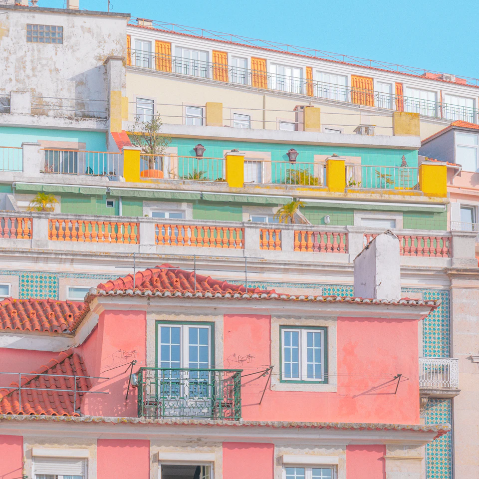 A cheerful row of colorful pastel houses in a sunny European town