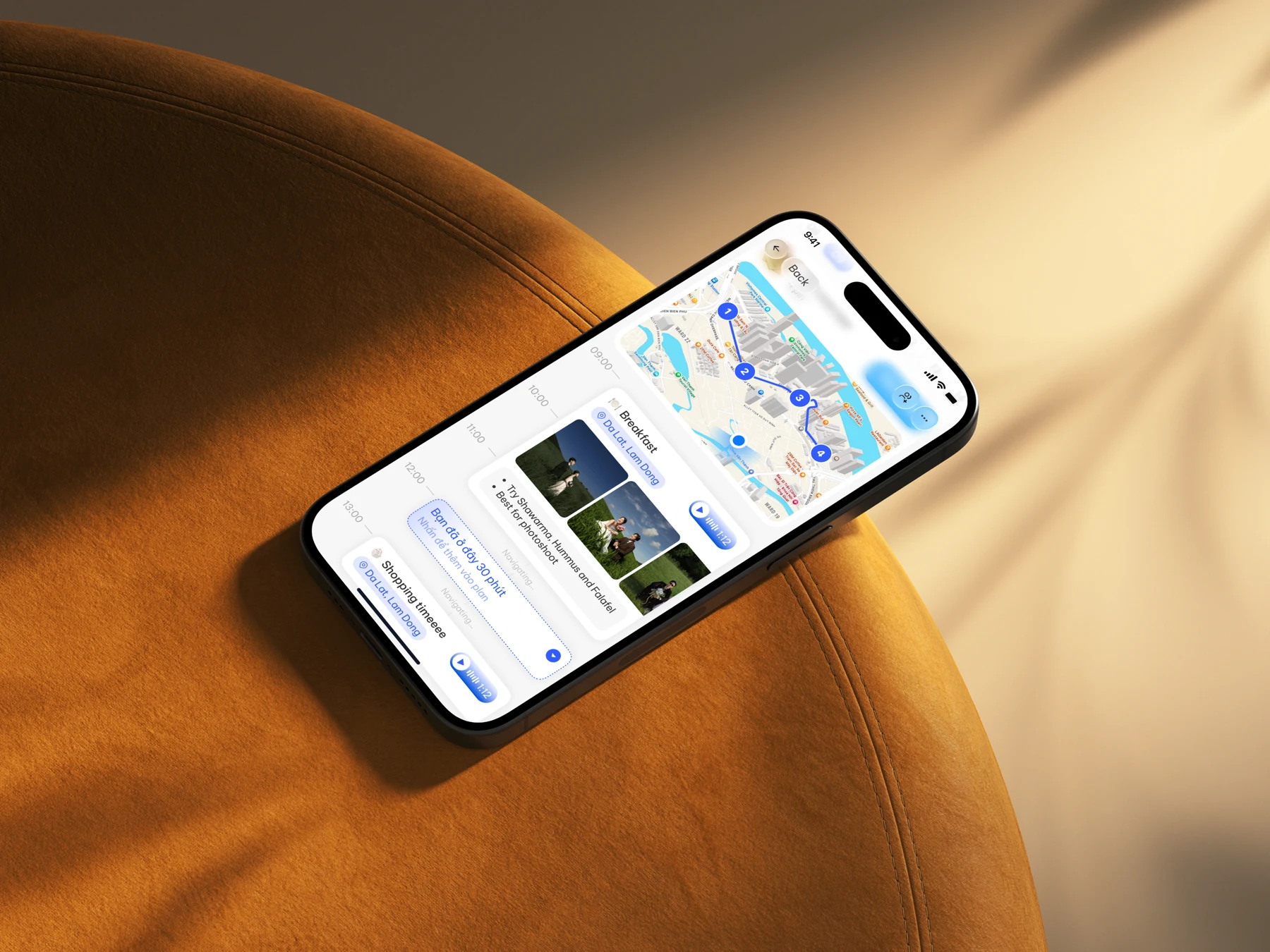 OnePlan itinerary and map on an iPhone, on a warm golden chair